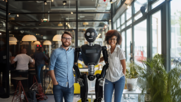 two co-workers embracing a robot in an office